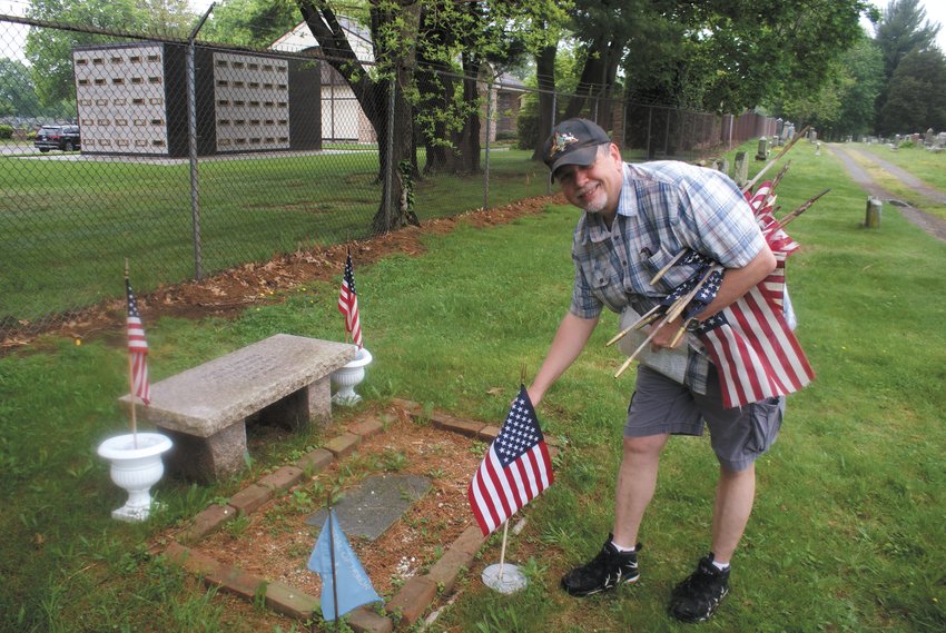 IN REMEMBRANCE: Ron Barnes, Camp 7 Commander, placed a flag at the headstone of John Edwards Medal of Capt. of TOP U.S. Navy Civil War.