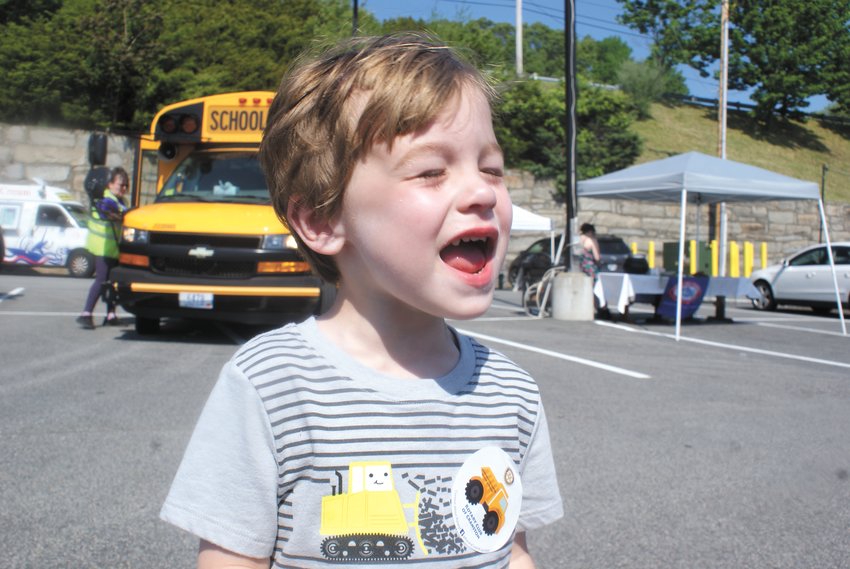 FIRST ARRIVAL: Henry Fallon, 3, arrived at the Cranston Rotary Touch a Truck on May 22 in Garden City Center with his family. (Photo by Steve Popiel)