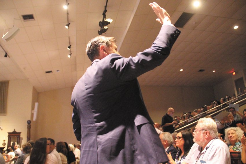 WAVING IN APPRECIATION: Seth Magaziner rises to thank convention delegates following the vote giving him the party&rsquo;s nomination for the Second Congressional District.