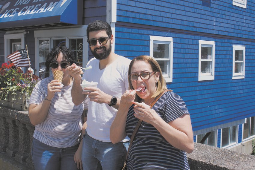 PICKING THEIR FAVORITE FLAVORS: Enjoying their favorites on the Pawtuxet River Bridge were Elizabeth Sanchez (chocolate chip cookie dough), Richard Valcarcel (pistachio) and Gilma Alvarez (watermelon sherbet).