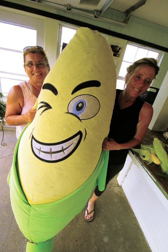 MEET CORNELIUS: Rose Pasquarelli and Victoria Sullivan meet up with the Morris Farm mascot, Cornelius.