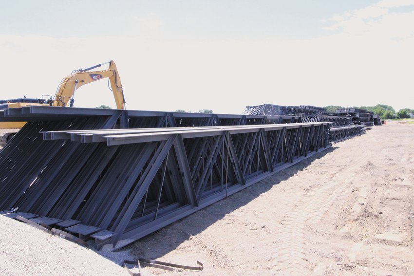 READY AND WAITING: Steel trusses to hold the roof of the warehouse being built off Commerce Drive await the walls of the building. (Warwick Beacon photo)