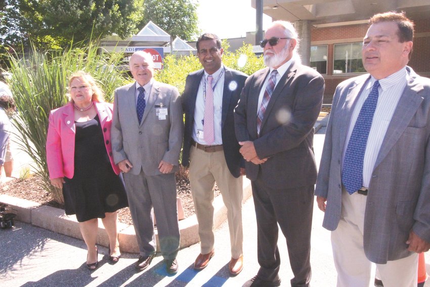 THANKING JOE:  Care New England and Kent Hospital officials turned out Tuesday to express appreciation to House Speaker K. Joseph Shekarchi who shepherded legislation and state budget appropriations ensuring that Kent can remain for the foreseeable future non-profit and independent. Gathering for a photo outside the hospital are from left, Carolynn Masters, Dean, School of Nursing, Rhode Island College and a CNE Board Member; Ken Naught, chair of the Kent Quality Oversight Commission; Dr. Paari Gopalakrishnan, president and chief operating officer of Kent Hospital; Warwick Rep. David Bennett and Shekarchi.  (Warwick Beacon photos)