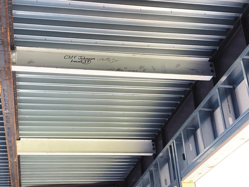 MAKING THEIR MARK: The beam that Garden City students signed is located in the school&rsquo;s transition area, which is between the gymnasium and learning commons. (Herald photo)