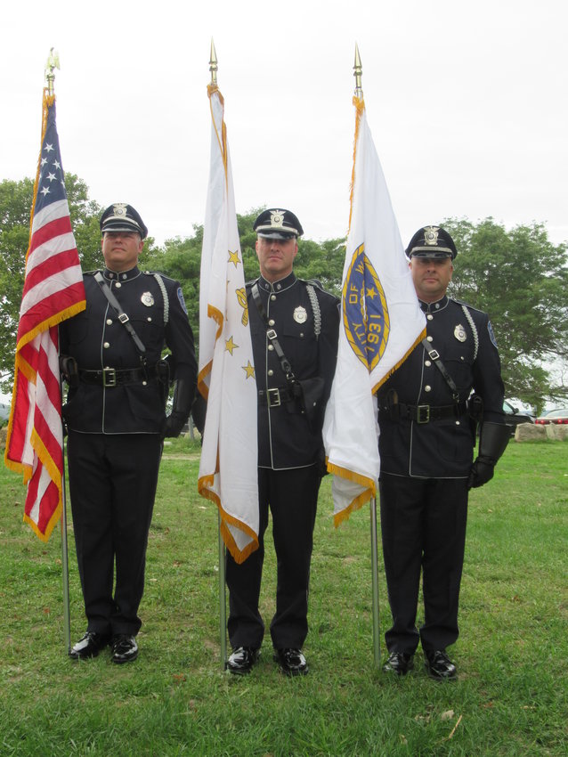 CLASSY COLORS: The Warwick Police Color Guard was one of several units that took part in Sunday&rsquo;s 9/11 remembrance at the Oakland Beacon Memorial Park Monument. The officers are, from left: Damian Andrews, James Vible and Adam Arico. (Warwick Beacon photos by Pete Fontaine)