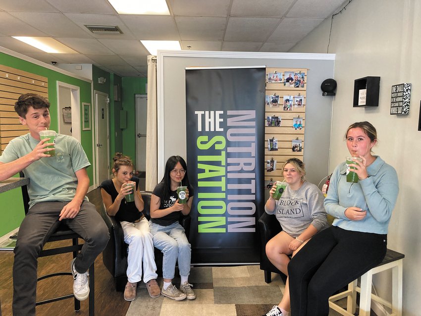 TASTE TESTERS: Members of the student council and yearbook club agreed that The Crusher is refreshing and has a green Jolly Rancher taste. From left: Connor McDonough, Simone Pellegrino, Eileen Phan, Talya Martins and Kylie McCreavy.