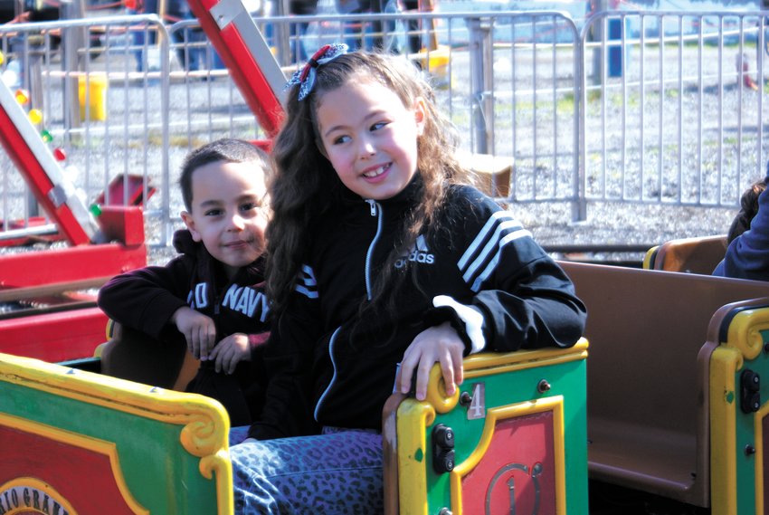 ALL ABOARD: Abraham Atiles, 3, and his sister Norah, 7, from Providence are excited for their train ride.