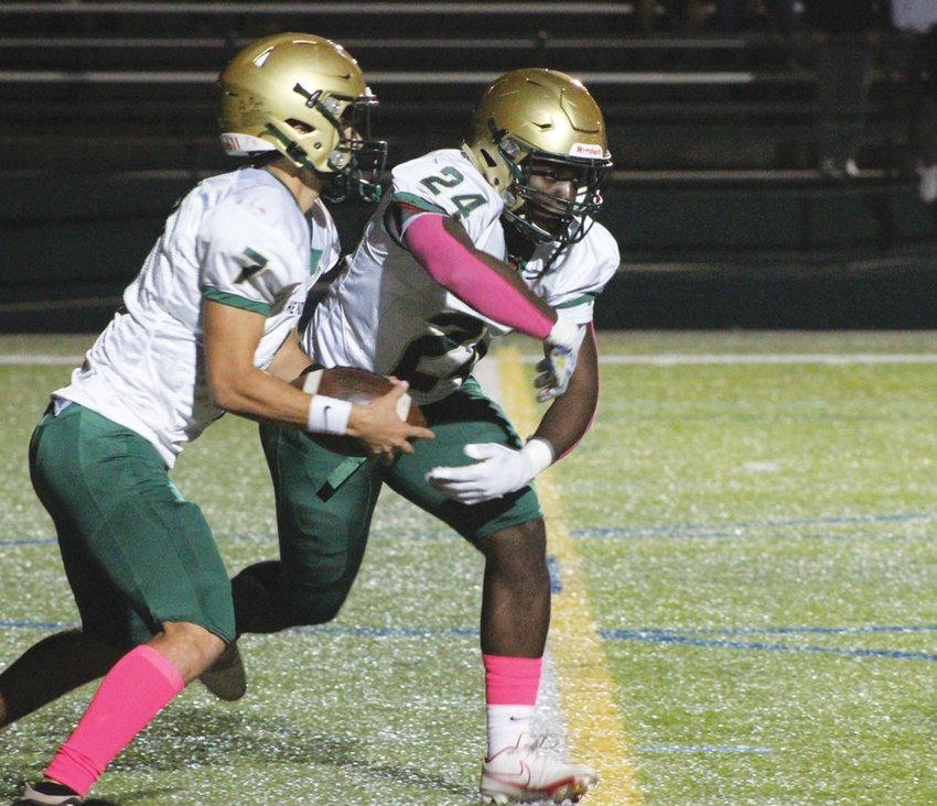 PLAY ACTION: Hendricken running back Ronjai Francis fakes the handoff last week. (Photos by Alex Sponseller)