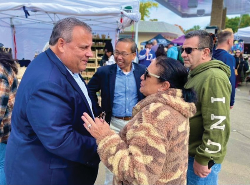 ON THE TRAIL: Allan Fung, center, and former U.S. Presidential candidate and ex-Governor of New Jersey Chris Christie, at left, campaigned around the Ocean State through the Columbus Day weekend, appearing on Federal Hill, and met with Rhode Island constituents at the Scituate Arts Festival, shown here.