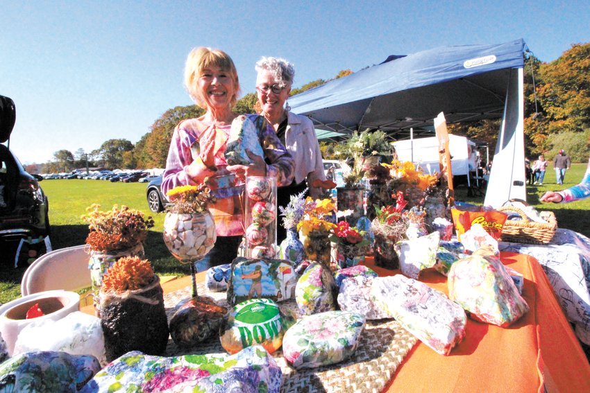 BEDROCK TO A SMALL BUSINESS; Paula Lopes and Cheryl Sitzler at their first craft show selling painted rocks. The name of the business: Fish Talk Creations.