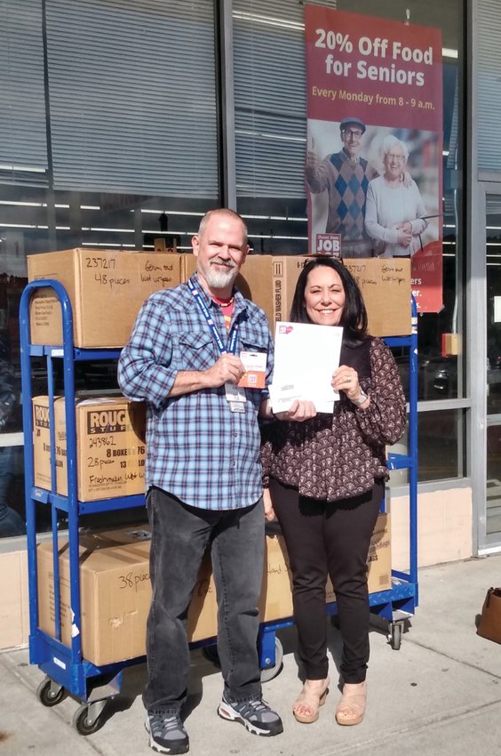 GIFT RECEIVED: Tammy Flanagan Gallo, Exec. Director, East Greenwich Animal Protection League and Jim Savard, Assistant Store Team Leader, Ocean State Job Lot, Cranston. (Submitted photo)