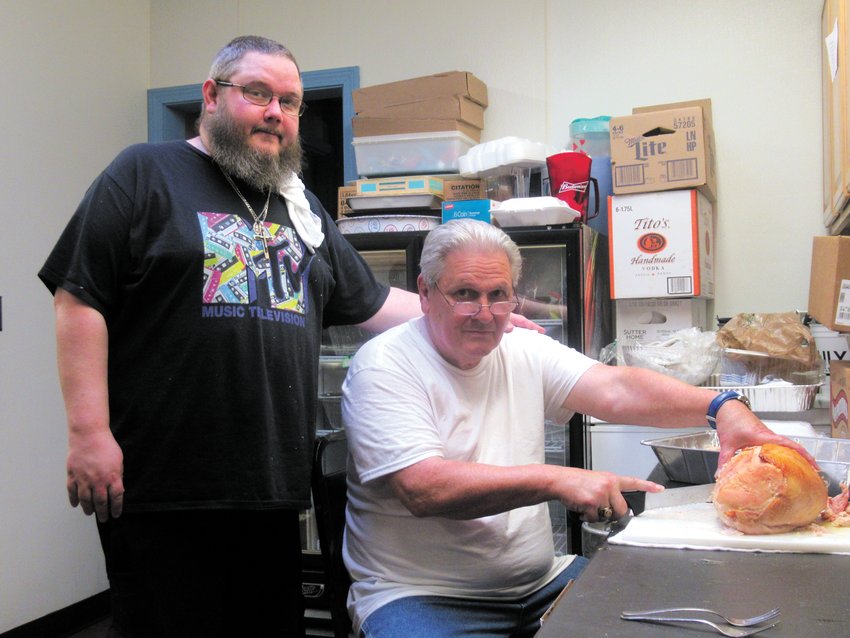 CLASSIC CHEFS: The father and son tandem of Bill Justice and his son Chris received rave preparing and cooking last Thursday&rsquo;s Oakland Beach Firemen&rsquo;s Club Thanksgiving Dinner. (Warwick Beacon photos by Pete Fontaine)