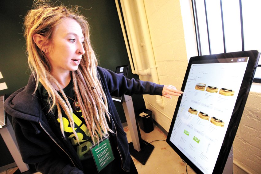 ARRAY OF PRODUCTS: Danielle Horn who works for RISE out of state was in Rhode Island to help coordinate the opening of recreational sales from the RISE store in Warwick. The store offers 22 products.   She was excited to see the state, visiting Rocky Point Park and planning to see Newport.  (Cranston Herald photos)