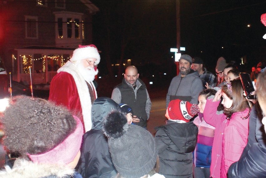 TALKING WITH THE YOUNGSTERS: Santa greeted kids at the Grange Tree Lighting on Dec. 8.