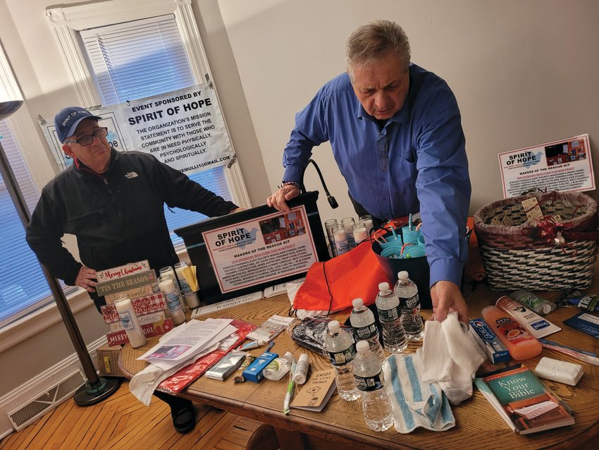 SPIRIT OF HOPE: Louis Spremulli, left, and Paul Orlando, right, presented their Spirt of Hope &ldquo;rescue kits&rdquo; to the Providence Rescue Mission on Cranston Avenue in Providence. Orlando said the number one item in every kit is a pair of new, fluffy white socks. (Warwick Beacon photos by Rory Schuler)