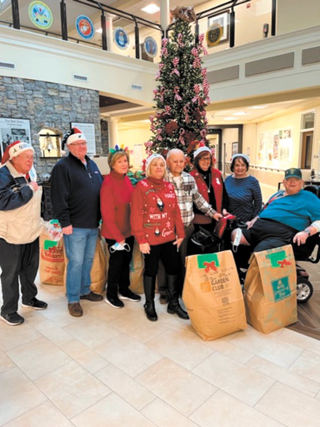 THE SPIRIT OF GIVING:  The General Federation of Women&rsquo;s Clubs &ndash; Rhode Island filled the wish lists of many at the Veterans Home in Bristol with the delivery of 35 bags of items last week. Pictured from left are: Rick Andrews, Paula Andrews (GFWC RI State President), Karen Leach (GFWC RI Veterans Affairs Chairman), WWII Veteran Ernie Cafolla, Janet Trombetti (GFWC Warwick Women&rsquo;s Club President), Sandra Pannone (Bristol County Women&rsquo;s Club Member), Alan Leach and in front, Vietnam Veteran Richard Either. (Submitted photo)