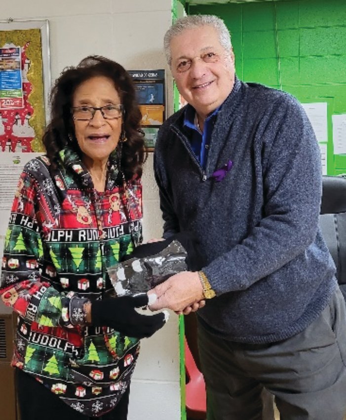 DELIVERING HOPE: Joan McDonell and Paul Orlando pose for a photo at the John Hope Settlement House. (Submitted photo)