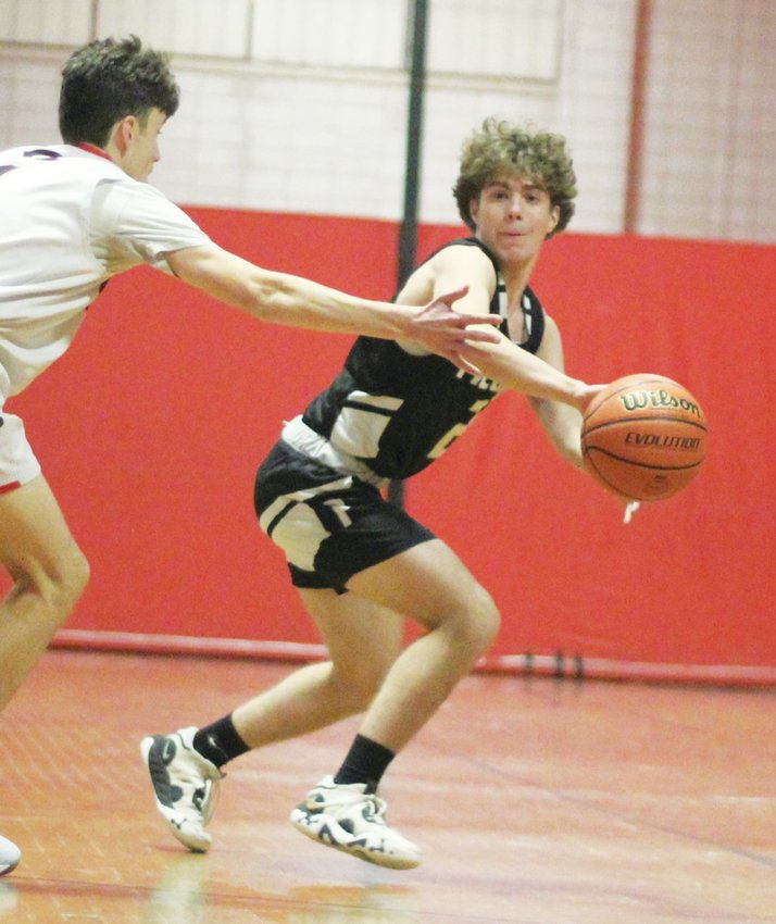 PASS THE ROCK: Pilgrim&rsquo;s Dylan Vale dishes a pass on Monday. (Photos by Ryan D. Murray)