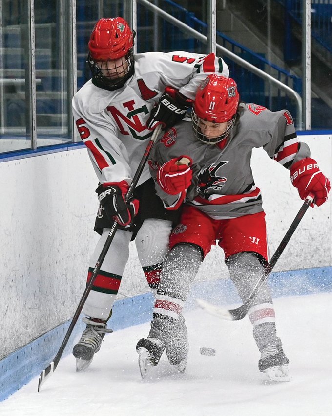 CHECK: Brady Scanlon checks an opponent into the boards. (Photos by Leo van Dijk/rhodyphoto.zenfolio.com)