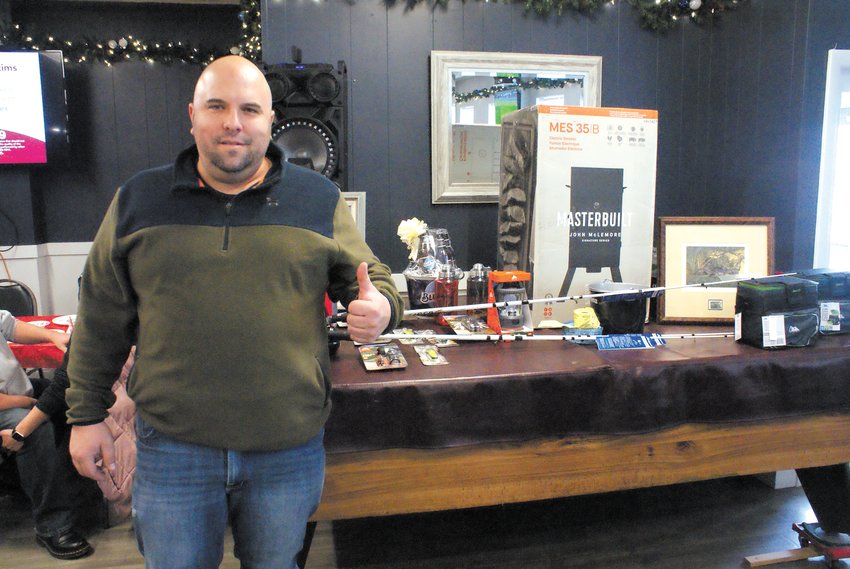 A PLETHORA OF PRIZES: St. Mary&rsquo;s Feast Society&rsquo;s President Matt Volpi pictured with raffle prizes from Feb. 5&rsquo;s event.