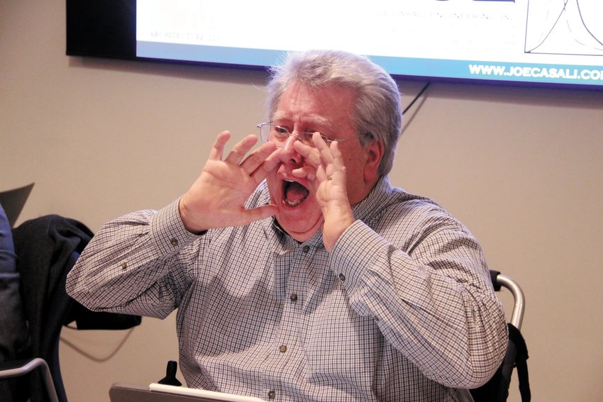 CAN YOU HEAR ME NOW? Planning Board Chair Philip Slocum didn&rsquo;t need a microphone to get across his request that people leave the room after the vote on 175 Post Road was taken so the hearing on other requests could resume. (Herald photo)