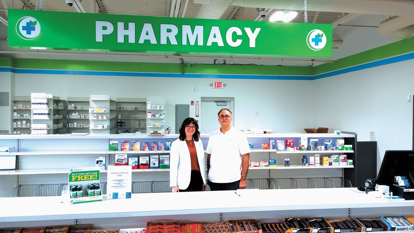 BRINGING THE PEOPLE A CHOICE: Zaheer Akbar and his pharmacist, Courtney, proudly prepare to serve the local people of Cranston and give them a choice in their care. (Cranston Herald Photo)