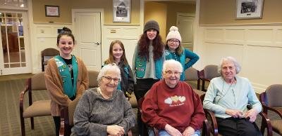 THE SURVEY SAYS: Girl Scouts from Troop 134 (left to right), Ava Furtado, Hannah McNally, Hadley King and Harper Lord make friends with residents (left to right)Barbara Winnerman, Beverly Tcath and Seena Dittleman.