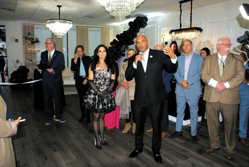 A WORD OF ENCOURAGEMENT: Director Economic Development Franklin Paulino says a few encouraging words as Owner and Creative Director of Dulce Vida Bebe Ingrid Guzman looks on. Dulce Vida Bebe is an event planning business located at 804 Resevoir Ave.