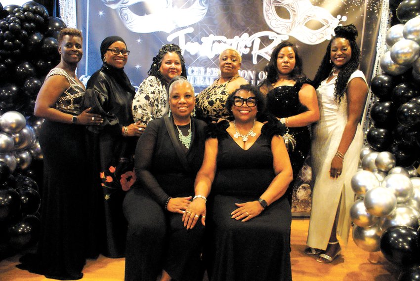 THE COMMITTEE IS IN: The Juneteenth RI Committee poses for a photo. President Helen Baskerville-Dukes and Vice President Pamela Hughes (front) smile for the camera as April Samuels, Secretary Jill Van Leesten, Treasurer Michelle Lacey, Keiojfa Hie, Heather Strother and Angel Cooper (left to right) stand in support behind them.