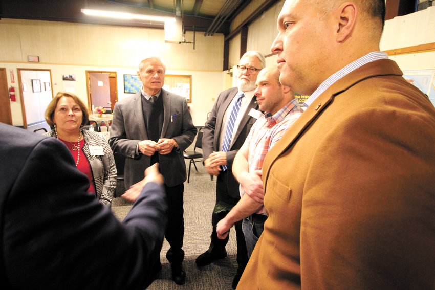 BREAKFAST TALK: Legislators, Dr. Judith Drew, professor at Salve Regina;  Daniel J. Kubas-Meyer  Thrive President/CEO, Rep. David Bennett, Sen. Anthony DeLuca and Rep. Thomas Noret  gather post-breakfast to talk about legislation.