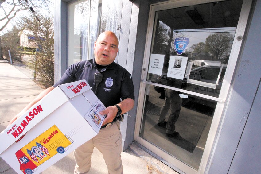 MOVING BACK IN: Officer Mark Jandreau, pictured, and Sgt. William Castaldi and Officer James Wenneman have been working out of the Police Athletic League offices on Bend Street ever since the Conimicut substation closed because of collapsing utility room floor late last year.  Now that the floor has been repaired the unit is returning to the village center.