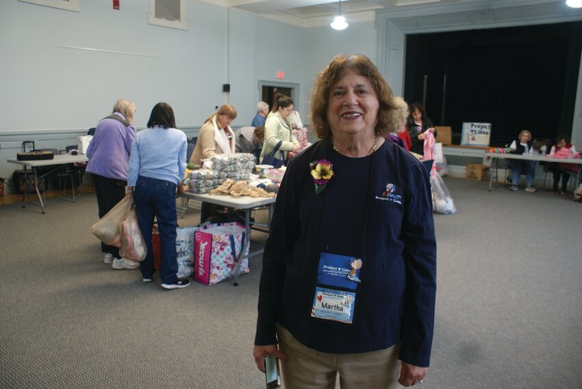 RUNNING IT ALL: Coordinator of Project Linus in RI Martha Sholes smiles with hopes of collecting as many as 300 blankets and quilts for those in need.