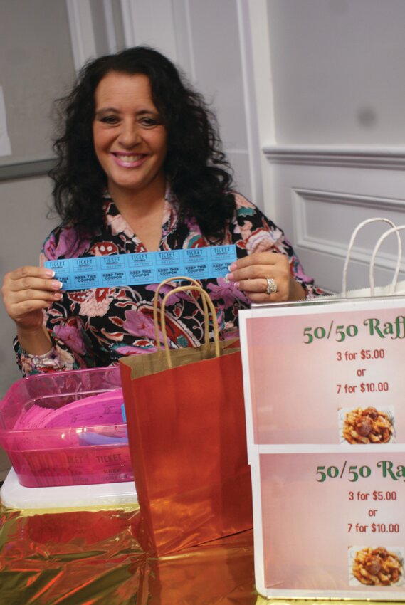 HELPING HANDS: Helping to make the event a success, Secretary of the Ladies Auxiliary Lynda Nardolillo sells raffle tickets to the 50/50 raffle. (Photos by Steve Popiel)