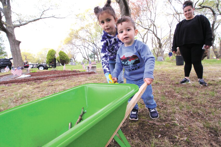 YOUNG RECRUITS:  Danny Hall&rsquo;s children Cora, 6, and his two-year old son Caleb joined in the cleanup. Looking on is their mother Bethany DeRosa.