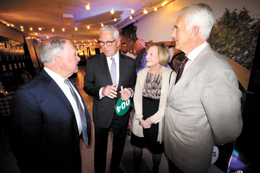 SHARING STORIES: Former Gov. Donald Carcieri, who was presented the school&rsquo;s Distinguished Public Service Award, is joined by former Warwick Mayor and retired Supreme Court Justice Frank Flaherty and Mr. and Mrs. Thomas Lynch.