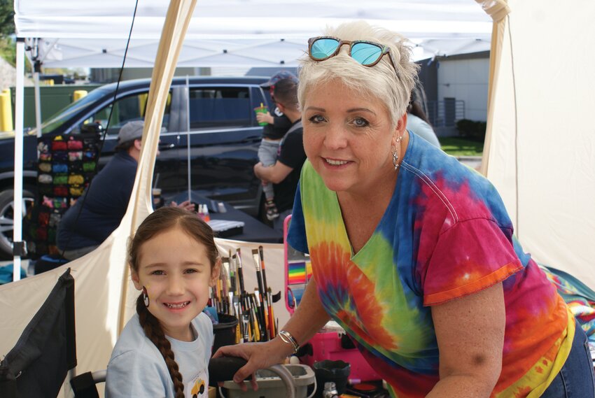 DAY OF DREAMS: The Rotary Club of Cranston held a &ldquo;touch a truck&rdquo; fundraiser at Garden City on Sunday May 7. It was here that five-year-old Brea Sanchez got to experience the work of Face Artist Toni Andersen, who decorated the young girl&rsquo;s cheek with a pokeball. (Photos by Steve Popiel)