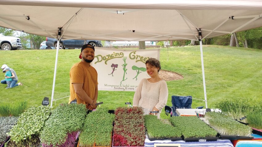 MICROGREEN MACHINE: Dancing Greens, located in Providence, RI, and owned by Darlyn Gomes-Hidalgo (right), shows off its selection of beet, radhish, arugula and broccoli microgreens for purchase. Microgreens can contain 40 times more nutrients than their fully grown counterparts. (Photos by Ed Kdonian)