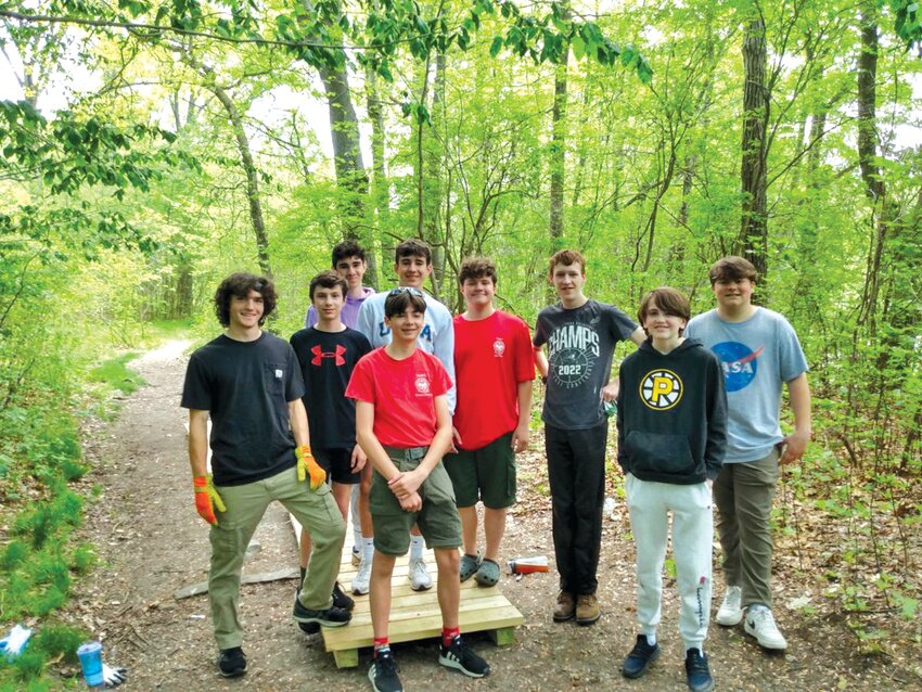 WE STAND TOGETHER: Eston Fowler, age 16, stands to the left next to friends and