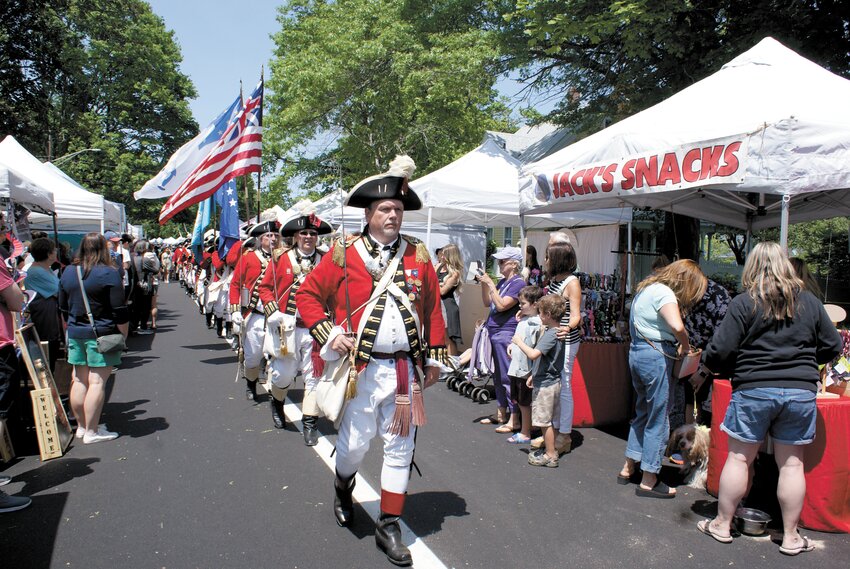 MARCHING STRONG: The Pawtuxet Rangers, one of the oldest chartered military militias in the country, march to celebrate the Gaspee Days festival. With the celebration going on all the way through June 11, those attending can still look forward to a host of wonderful attractions. June 3 will bring the Warwick Symphony Orchestra to Pawtuxet Park at 5:30 p.m. to entertain crowds with music and then fireworks will light up Salter&rsquo;s Grove, Warwick, starting at 9:30 p.m. The final weekend of Gaspee takes place over Saturday June 10 and Sunday June 11. Events will include Ecumenical Services from Trinity Episcopal Church and a Gaspee Days 5K race on Saturday before the annual Gaspee Days Parade, which begins at 10 a.m. and travels the length of Narragansett Parkway in Warwick. Sunday will bring the Blessing of the Fleet at Rhode Island Yacht Club  at 11 a.m., several events in Pawtuxet park, such as Sunday in the Park with live music and food at noon, a raffle drawing at 3 p.m. and the traditional Burning of the Gaspee at 4 p.m.  More photos on page 7. (Photo by Steve Popiel)