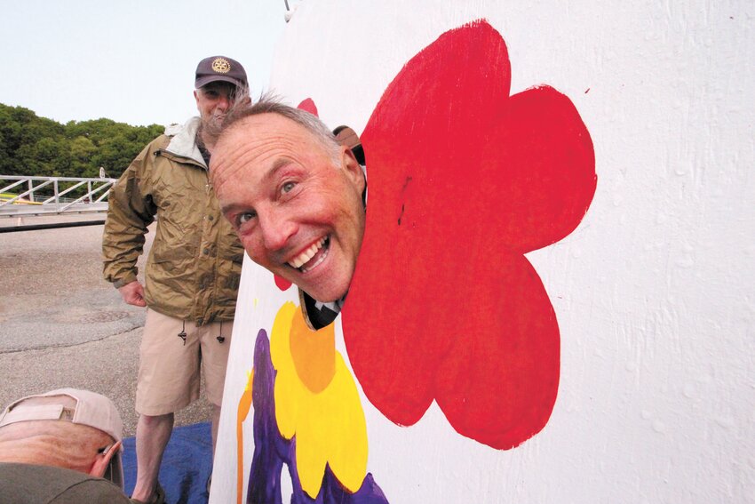 TARGET MAN:  Rotarian Dan Scanlon volunteers to stand behind the cut-out clown, faced wet sponges thrown by Warwick elementary students at the club&rsquo;s annual Christmas party. (Warwick Beacon photo)