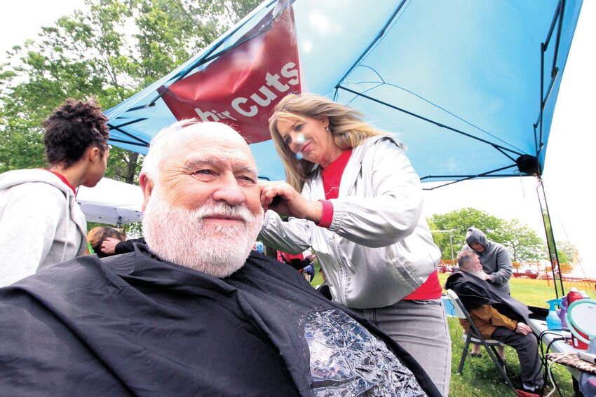 COULDN&rsquo;T PASS IT UP: Dan Chabot said when a friend told him he could get a free haircut Saturday he replied, &ldquo;I&rsquo;ll go.&rdquo;  Chabot was pleased with the trim that Michelle ably performed. (Warwick Beacon photos)