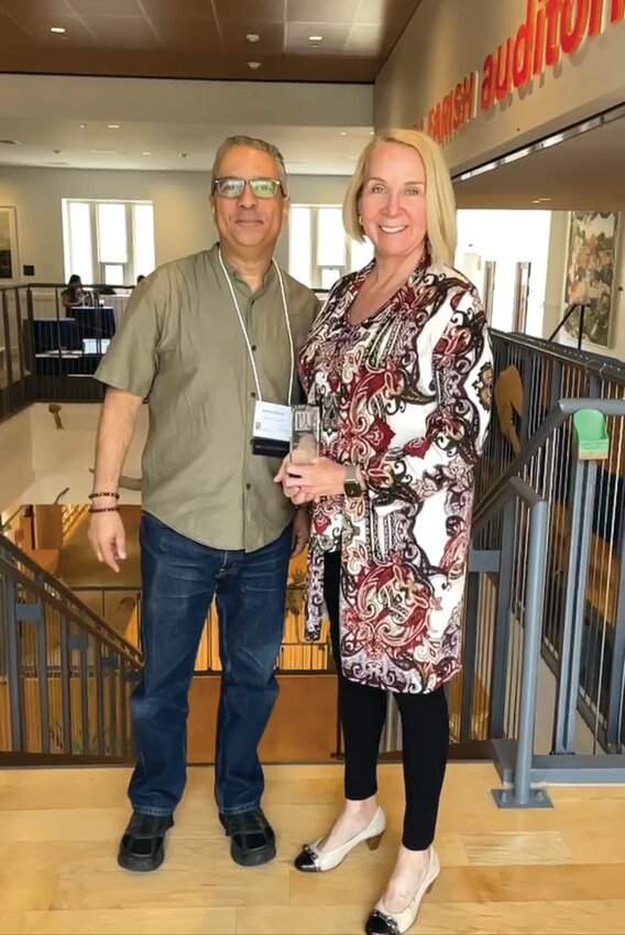 CONGRATULATIONS: Senator Hanna Gallo stands beside Director of Library Services Ed Garcia holding her Library Champion Award. (Submitted Photo)