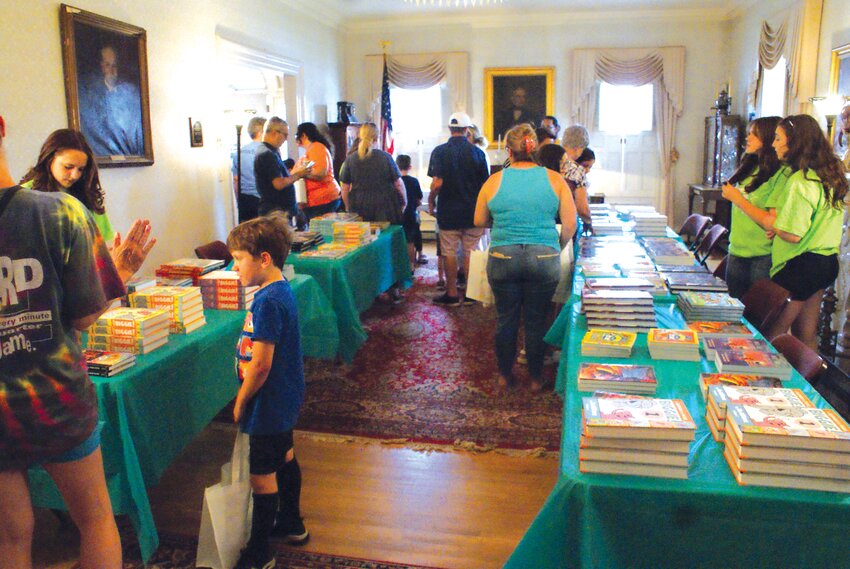 BOOKS GALORE: Sprague Mansion transforms its interior to make way for a bookstore and inspire an interest in reading in young children. (Photo by Steve Popiel)