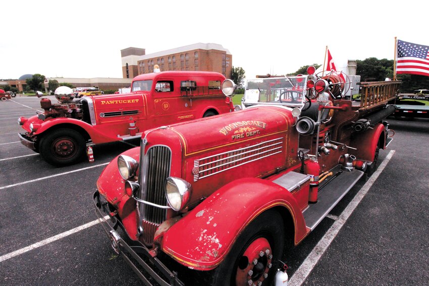 Antique fire apparatus enthusiasts respond to RI call  COMING HOME TO RI: This 1938 Woonsocket apparatus, now owned by a collector in Canada made the trip to the conference along with a truck that once belonged to the Pawtucket department. (Cranston Herald Photo)