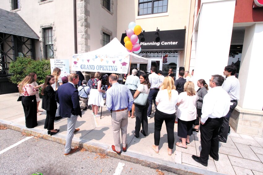 BRAND NEW: Ribbon cutting attendees greet one another in front of the new planning center. (Beacon Photo)