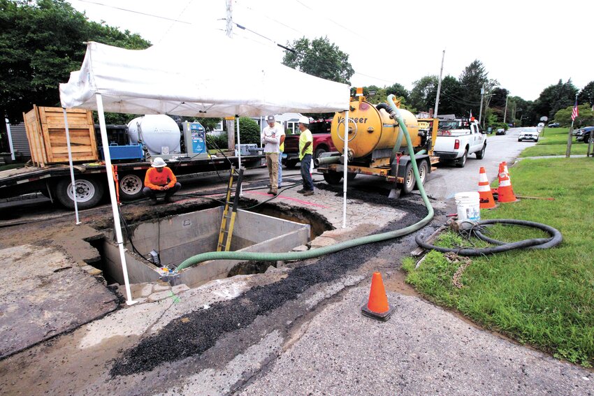 FIRST OF BAYSIDE HOME CONNECTIONS:  A bit of rain and threat of downpours didn&rsquo;t delay Hemlock Directional Drilling from bringing the first of the Bayside sewer project connections to homes on Beatrice Road Friday. The directional drilling provides for the connections without disturbing archeological features left by Native Americans. To accomplish that, a pipe is fed into the bore of the hole between the property and a pit for the sewer interceptor. (Warwick Beacon photo)