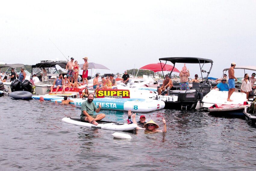 THE PLACE TO BE ON THE BAY: It was a boisterous and friendly crowd in Potter Cove. (Cranston Herald photos)