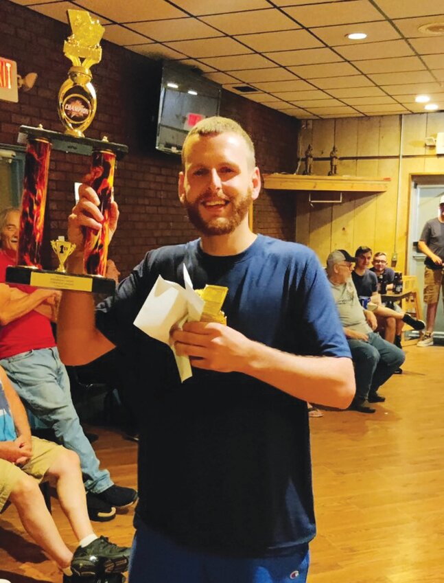 CHAMP&rsquo;S CORNER: Kevin LaPlume (right) is all smiles after receiving the Oakland Beach Firemen&rsquo;s Club Corn Hole League championship during last Thursday night&rsquo;s season finale. (Submitted photos)