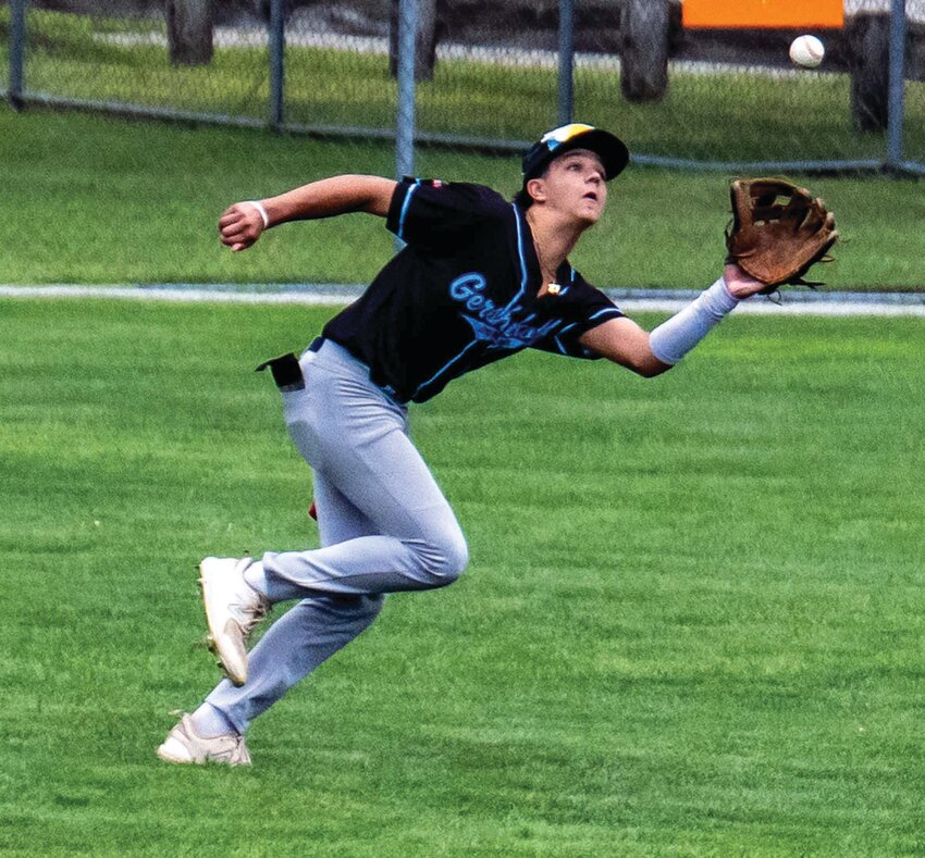 TRACKING IT DOWN: Gershkoff outfielder Gianni Santo chases down a fly ball last week during the regional tournament at McCarthy Field in West Warwick. Gershkoff dropped its first two games to wrap up its summer season. The club won the state championship the week prior. (Photos by Leo van Dijk/rhodyphoto.zenfolio.com)