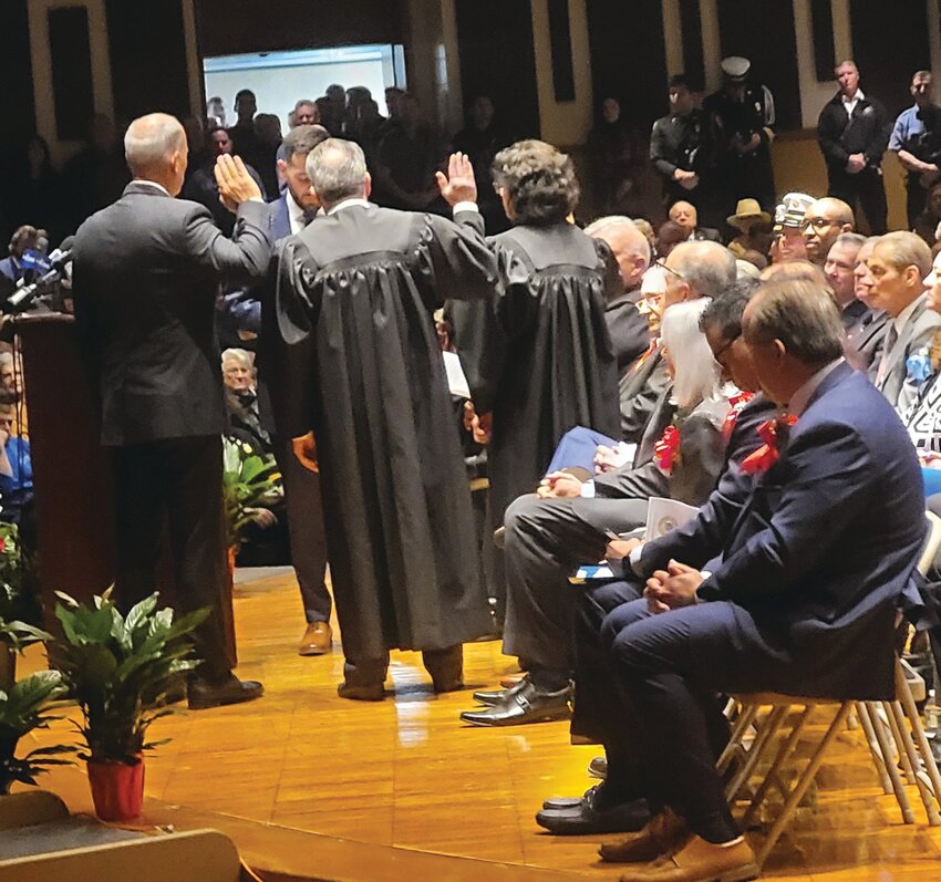 Mayor Joseph Polisena Jr. swore in three judges on his Jan. 9 Inauguration Night: Judge of the Johnston Municipal Court, David aRusso; Frank Manni as Auxiliary Judge; and Priscilla Facha DiMaio, Probate Judge (at right). DiMaio now faces charges and has been placed on leave pending the outcome of her case.(Herald file photo by Rory Schuler)